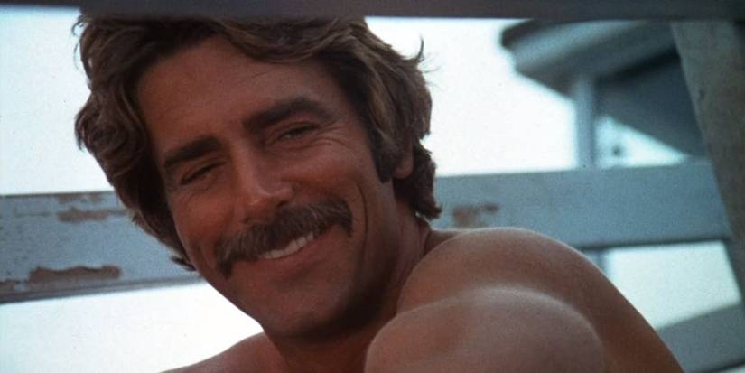 Sam Elliott smiles down at someone in Lifeguard