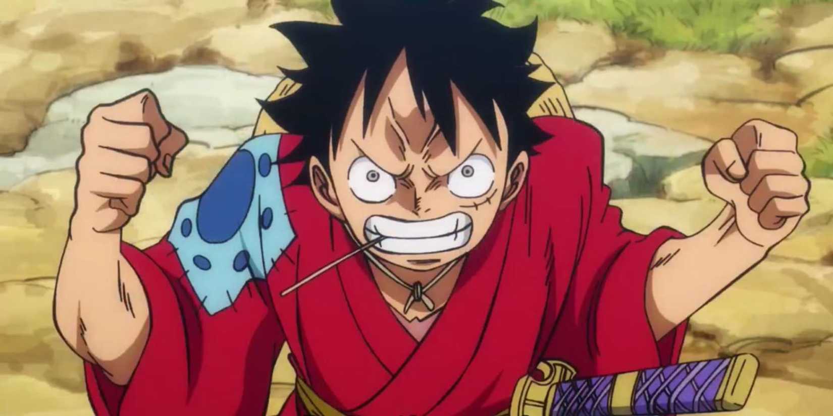 Monkey D. Luffy furiously staring at someone while chewing a straw