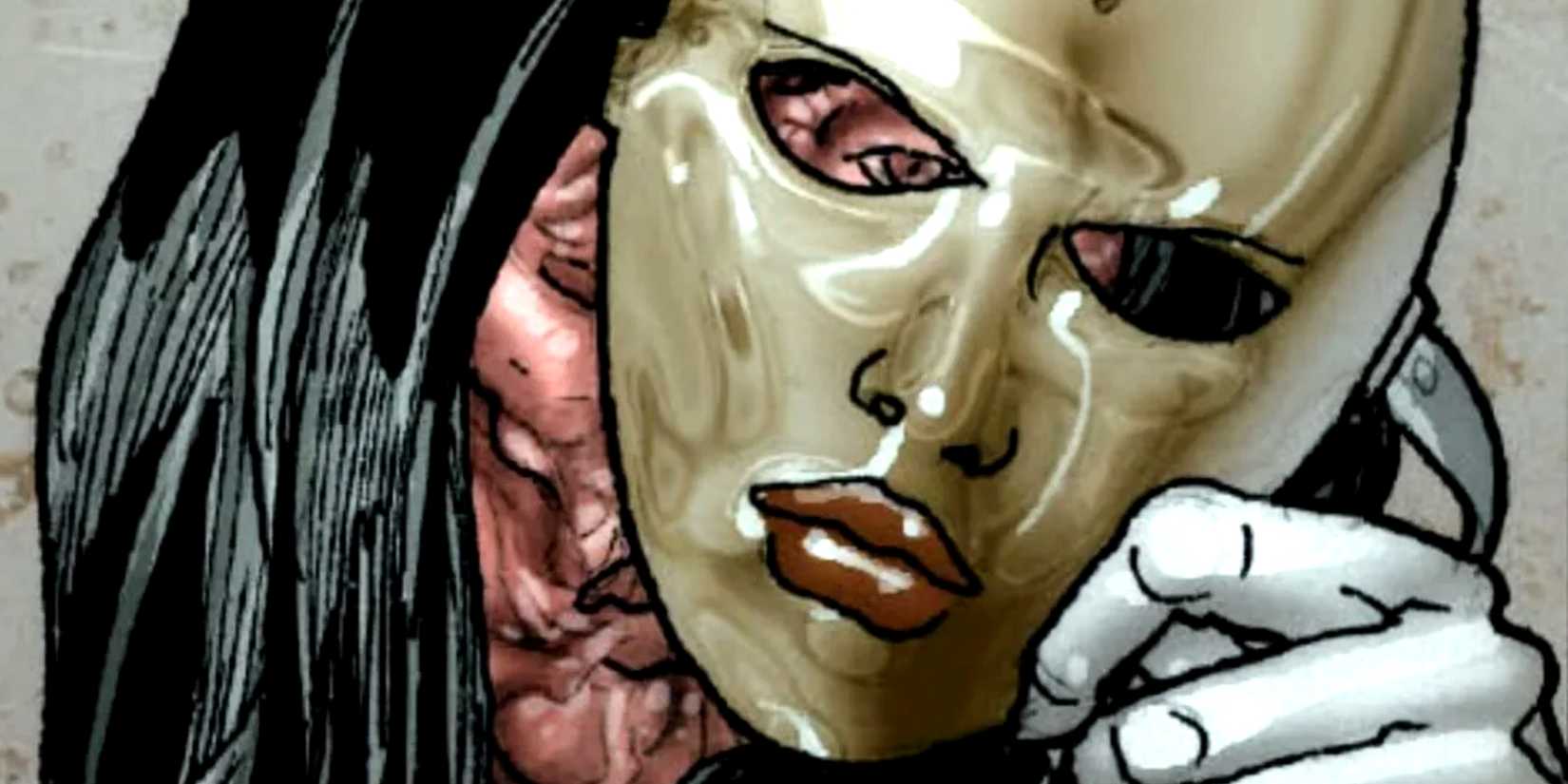 Madame Masque holds the mask in her hand