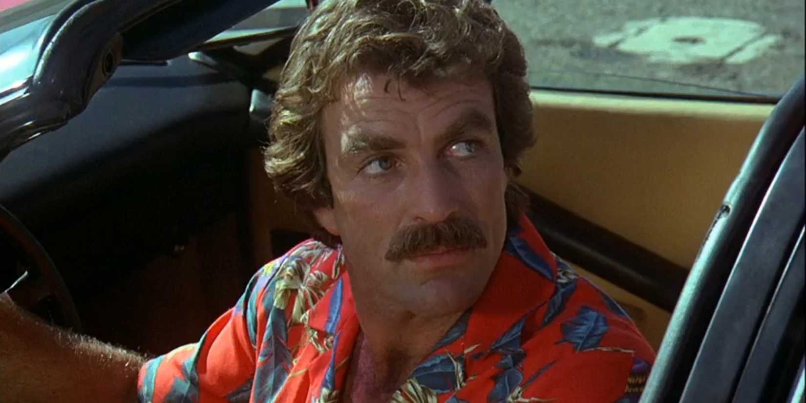 Tom Selleck as Thomas Magnum looking over his shoulder in Magnum P.I.