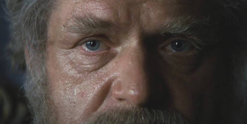A man stares with sad eyes in a scene from The Shooting Party