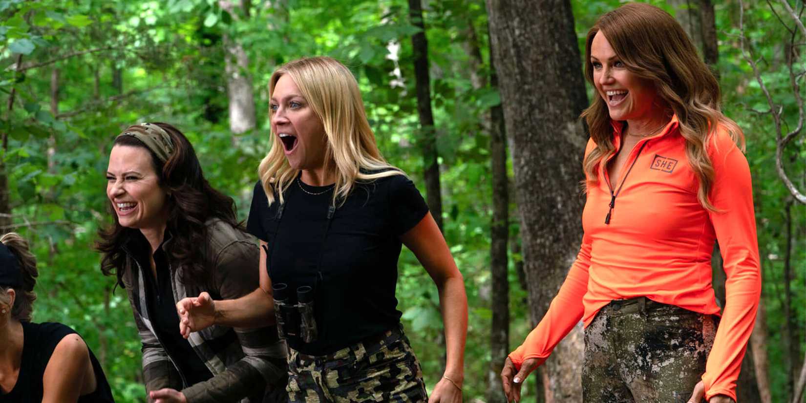 margot and sophie looking excited while in the forest in the hunting wives
