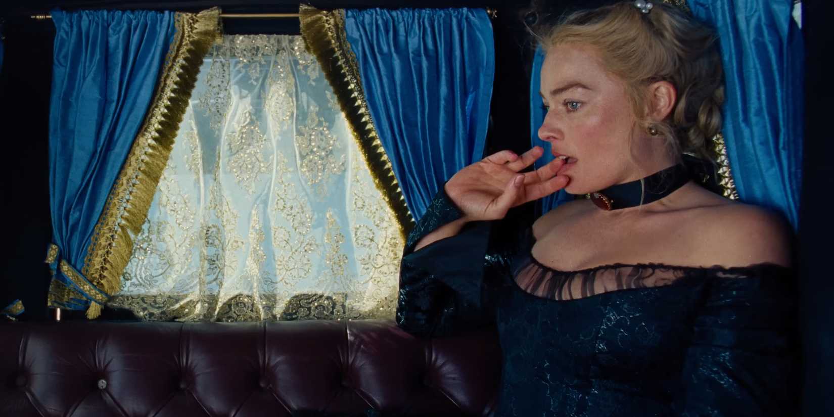 Margot Robbie rides in a carriage in the trailer for Wuthering Heights