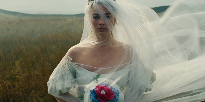 Margot Robbie wearing a wedding dress with a huge veil in Withering Heights 2026