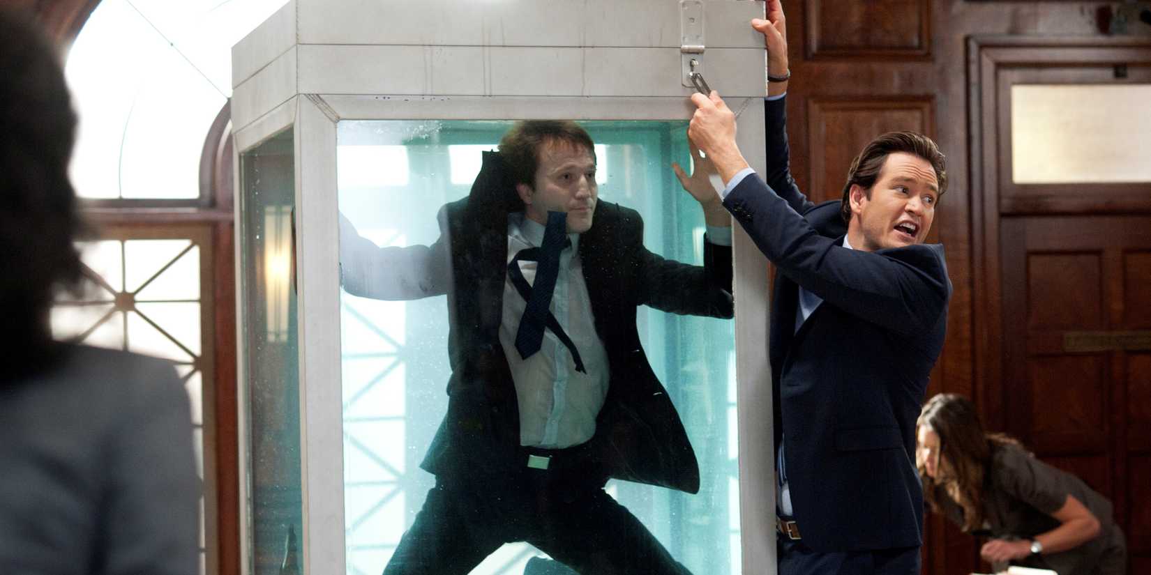 Mark-Paul Gosselaar trying to help Breckin Meyer escape a water tank from Franklin & Bash