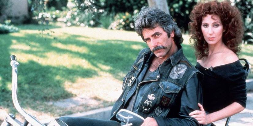 Gar and Rocky sit on a motorcycle in Mask