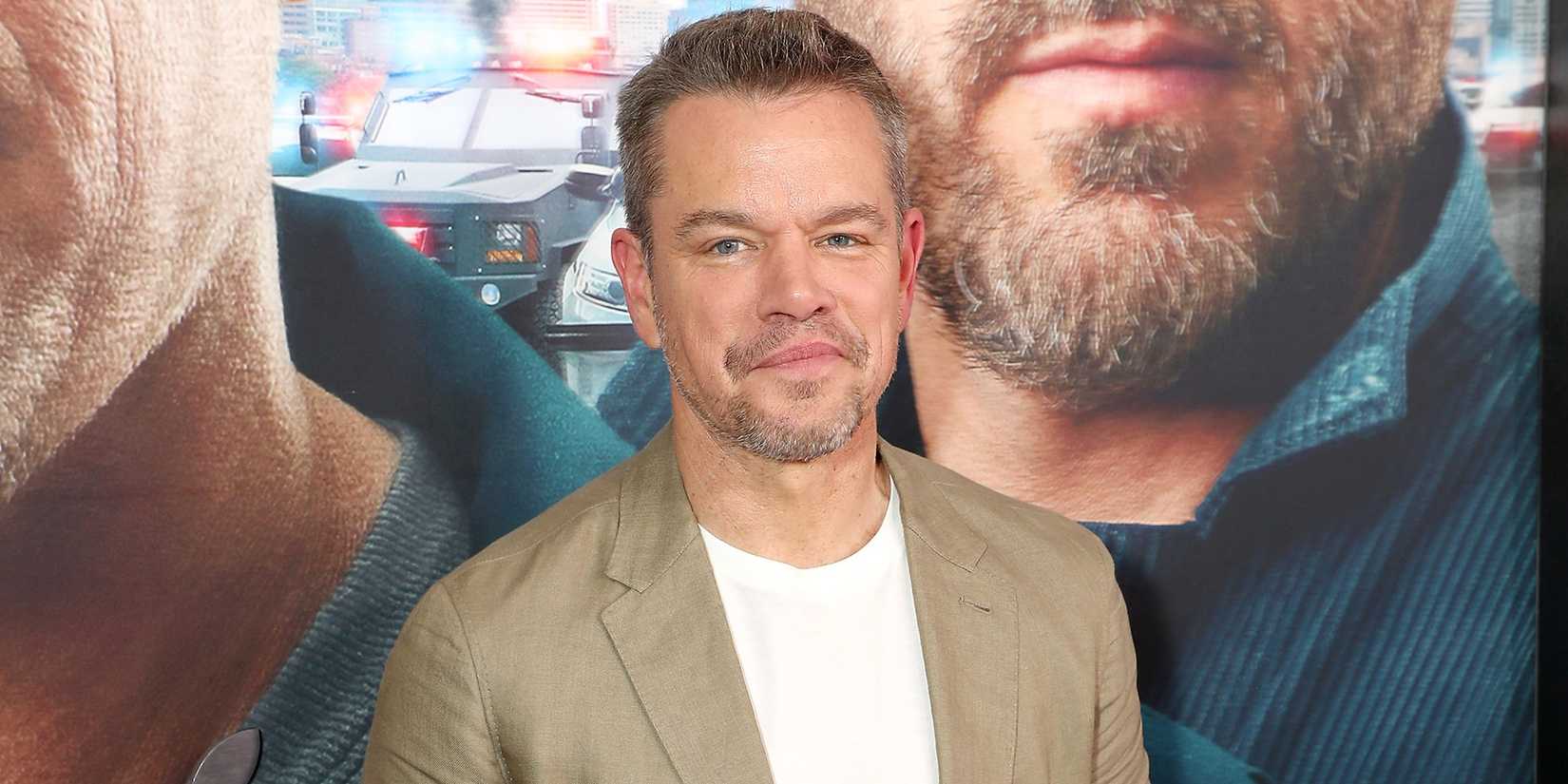 Matt Damon smiling while at the premiere of Instigators