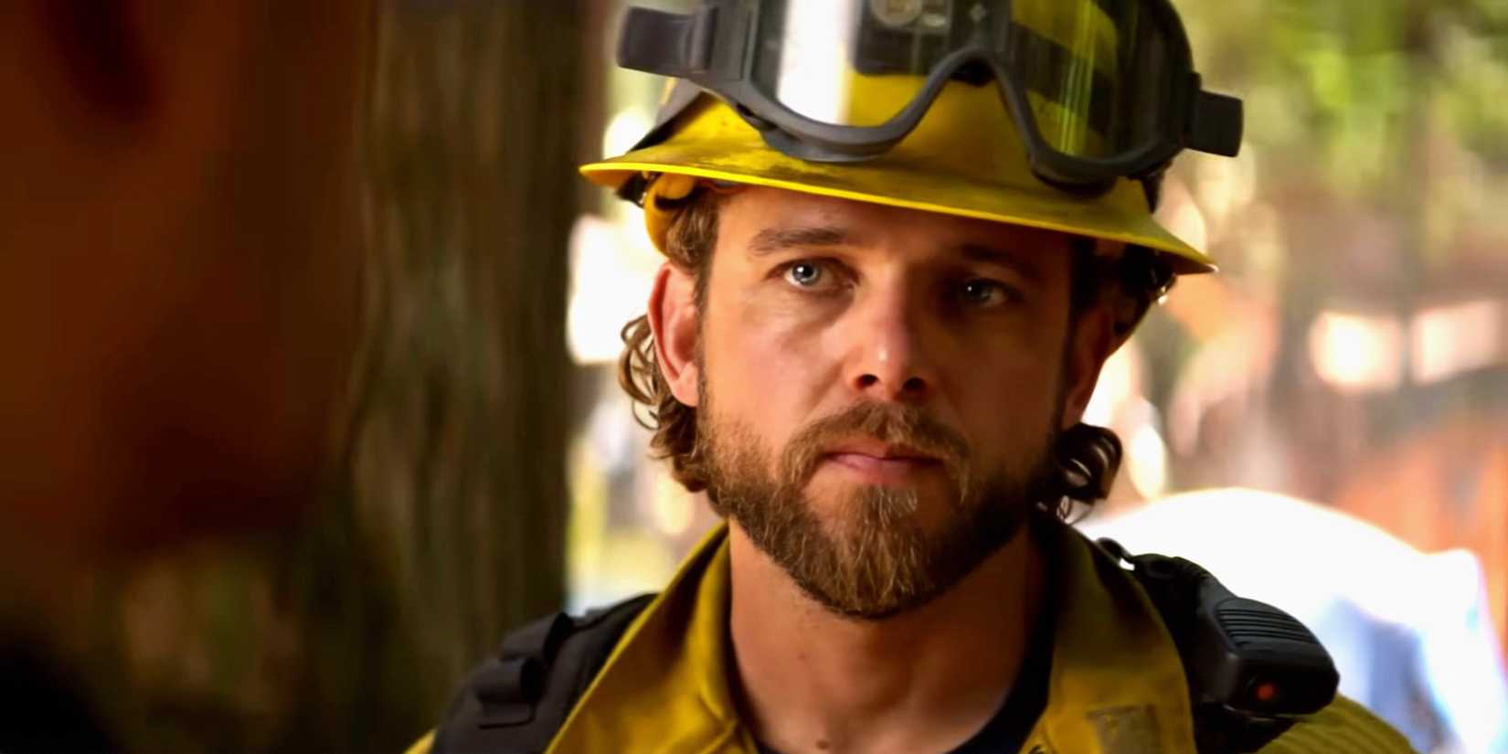 Max Theriot as Bode looking angry at someone while in his firefighter gear in Fire Country season 4