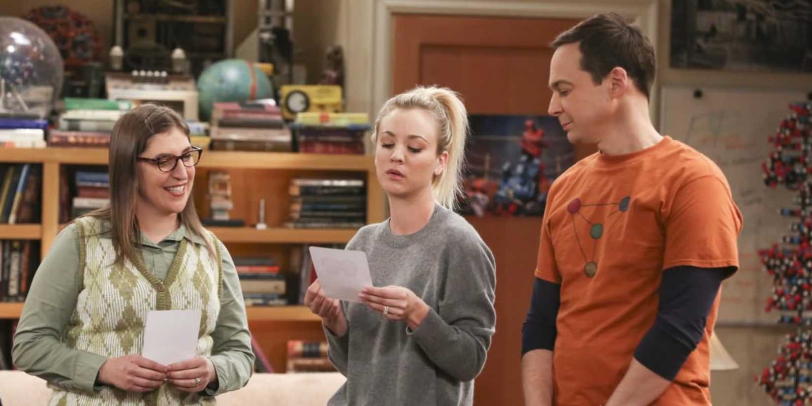 Mayim Bialik's Amy Kaley Cuoco's Penny and Jim Parsons' Sheldon stand together in The Big Bang Theory