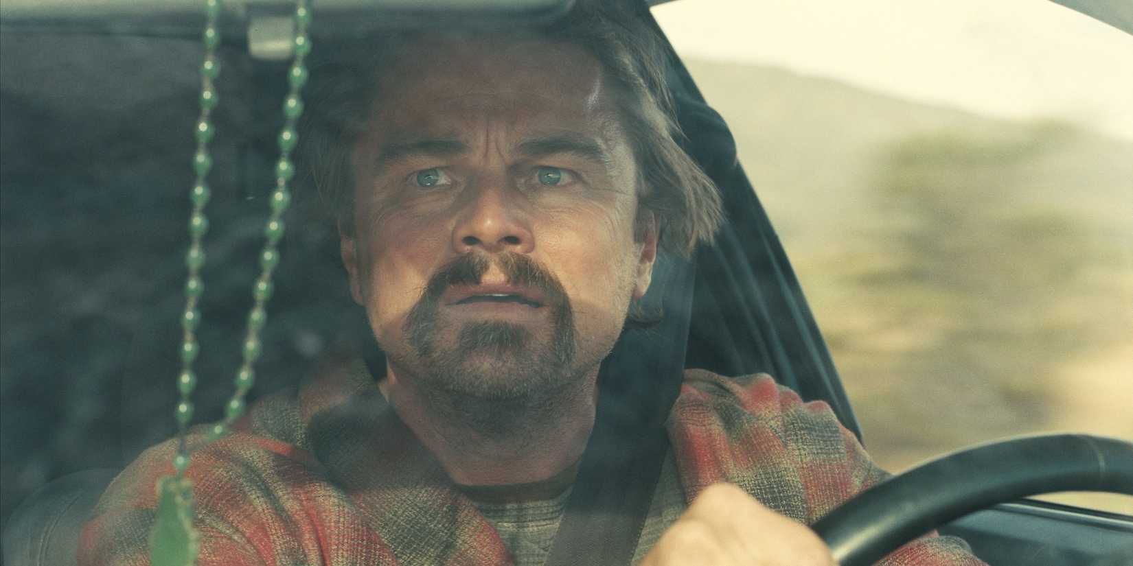 Leonardo DiCaprio drives a car in One Battle After Another