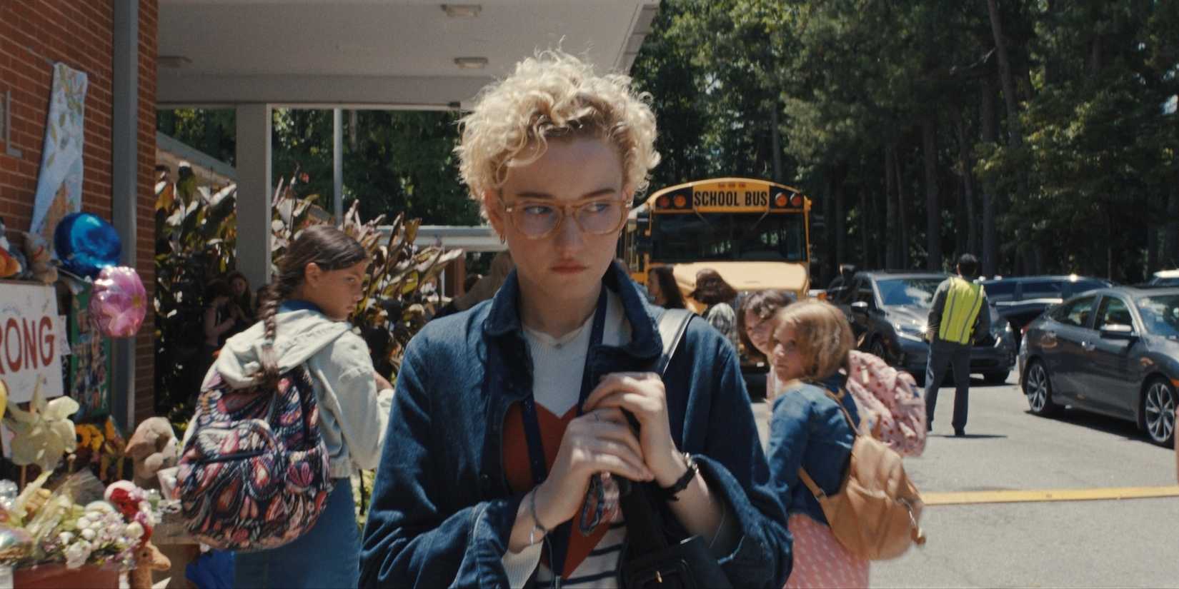 Julia Garner as Justine Gandy walks outside of a school in Weapons