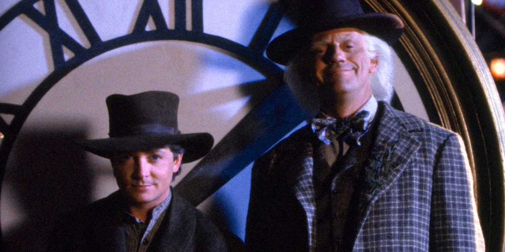 michael j fox s marty mcfly and christopher lloyd s doc brown pose for the clock photo in back to the future part iii