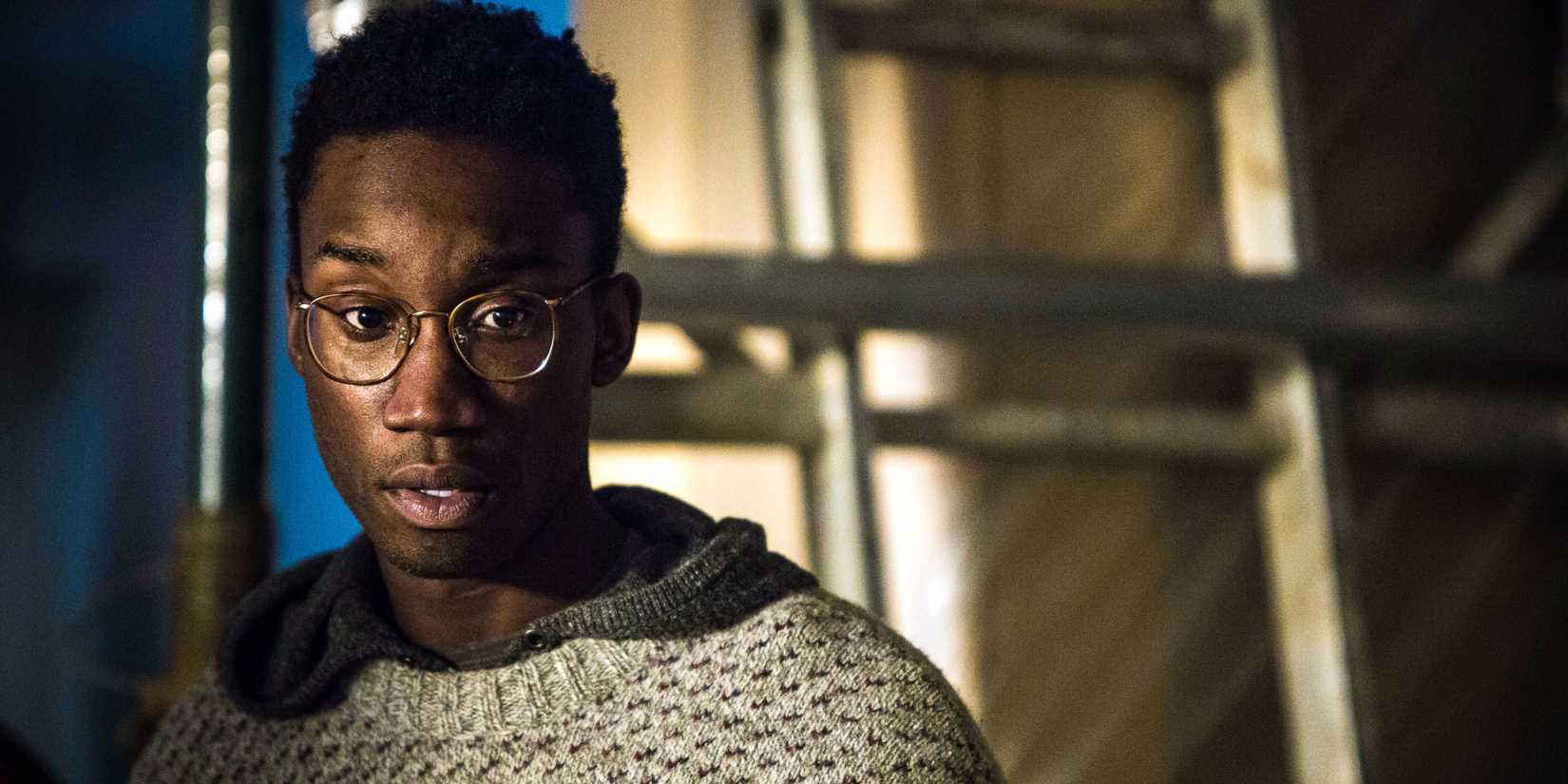 Nathan Stewart-Jarrett looking concerned In Utopia