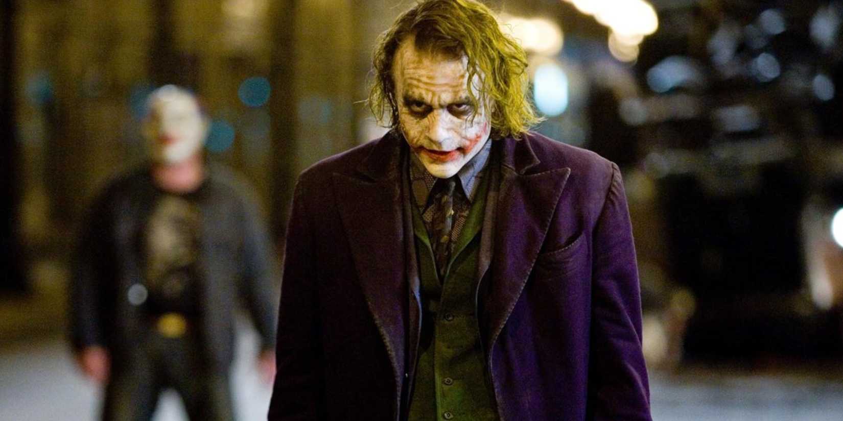 Heath Ledger in full Joker make-up and costume in the streets of Gotham City in The Dark Knight