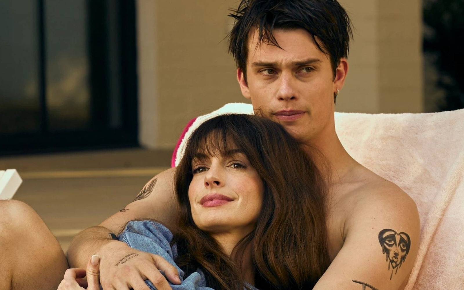 Passionate embrace of older woman and younger man, intimate hold