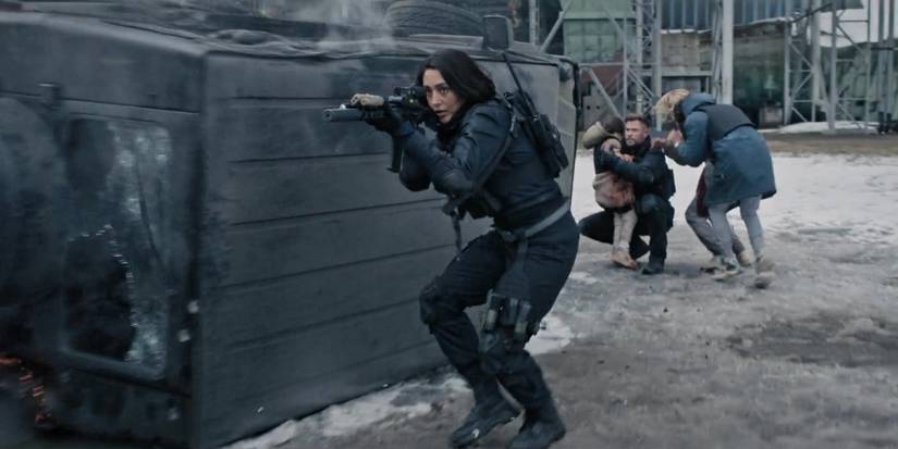 Golshifteh Farahani aiming a rifle as Nik in Extraction 2
