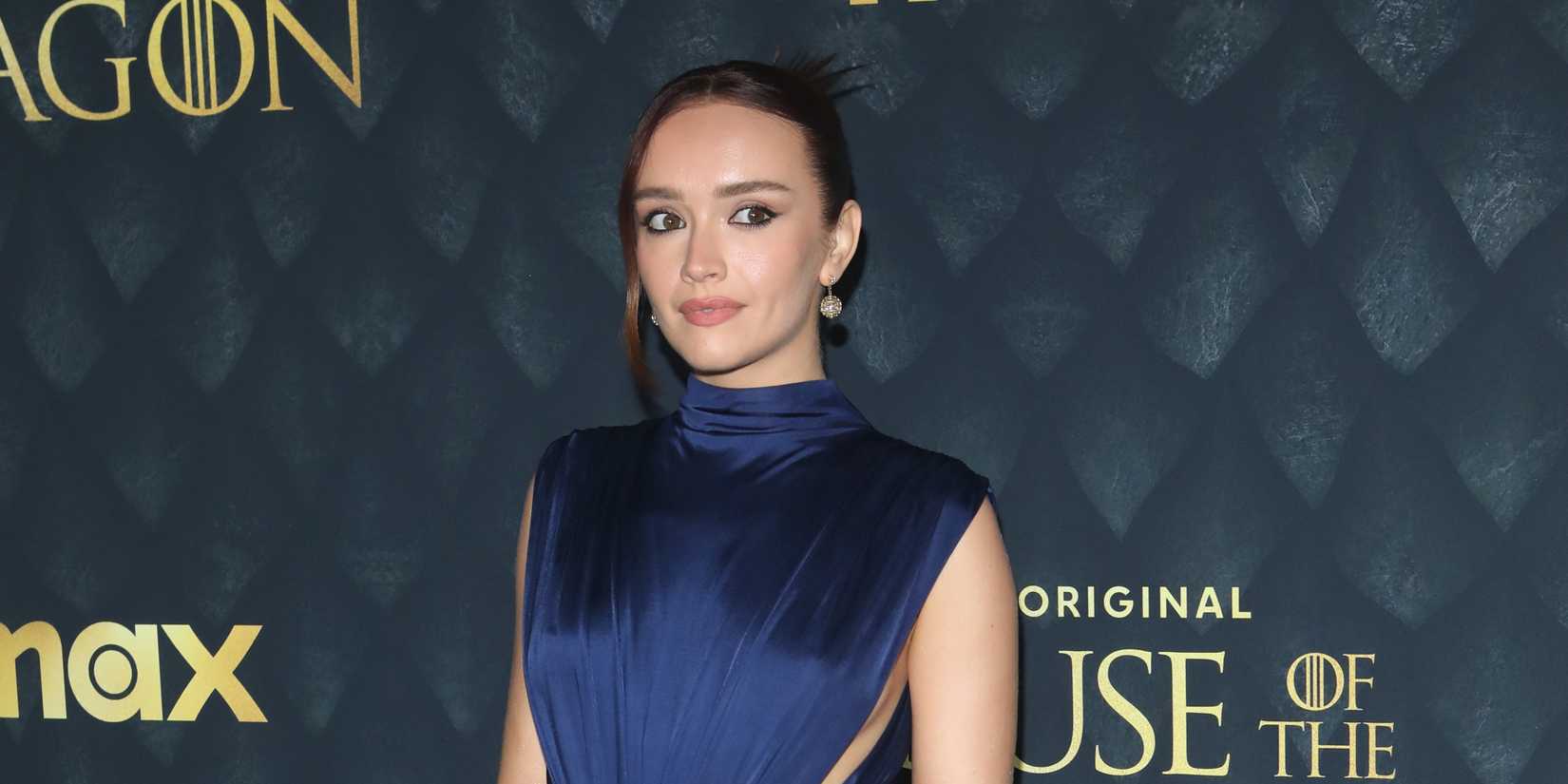 Olivia Cooke looking to the side on the red carpet