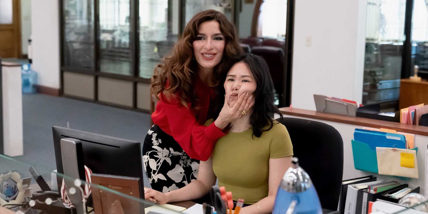 Sabrina Impacciatore as Esmeralda grabbing Ramona Young as Nicole by the cheeks in The Paper