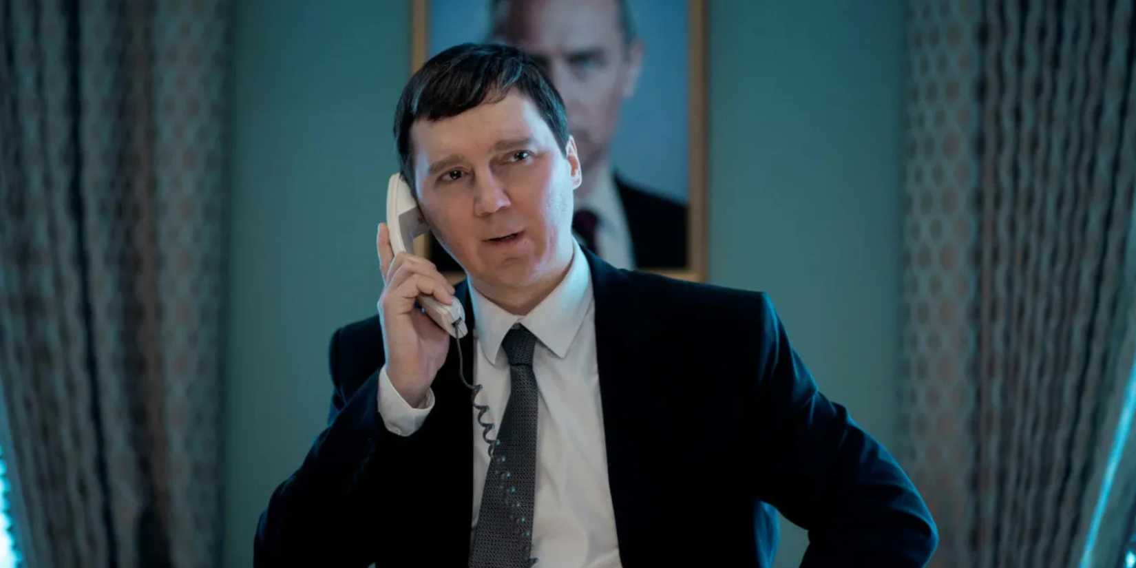 Paul Dano holding a phone to his ear in The Wizard of the Kremlin