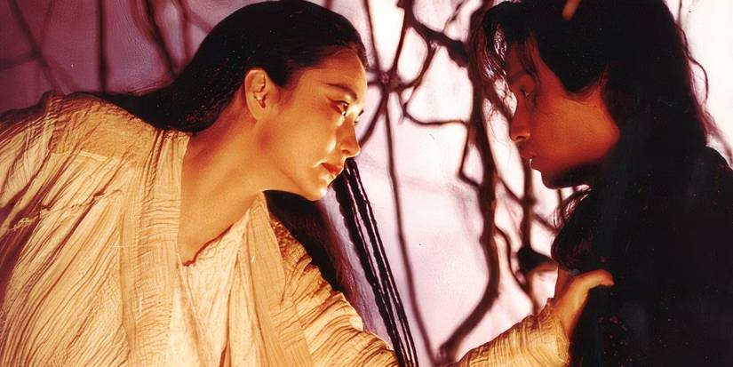 Qing (Brigitte Lin) holding Lian (Leslie Cheung) in The Bride with White Hair
