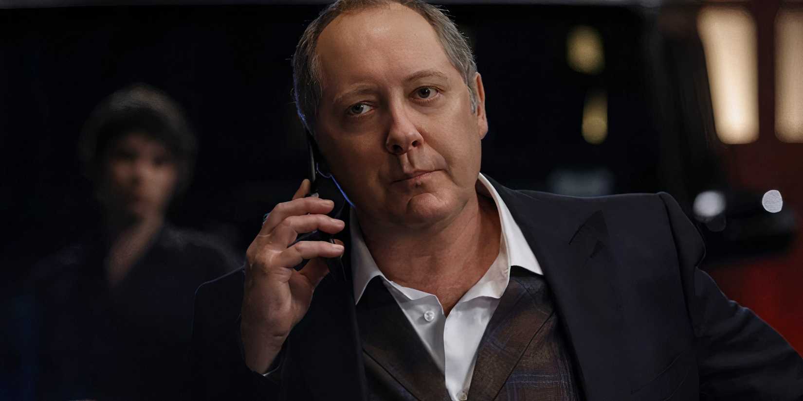 raymond reddington unimpressed while talking on his cell phone in the blacklist