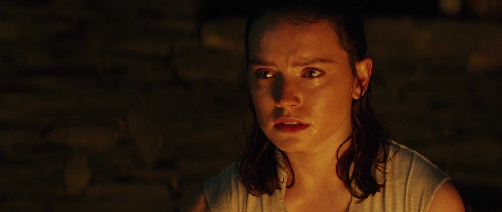 Rey in Star Wars The Last Jedi looking at Kylo Ren