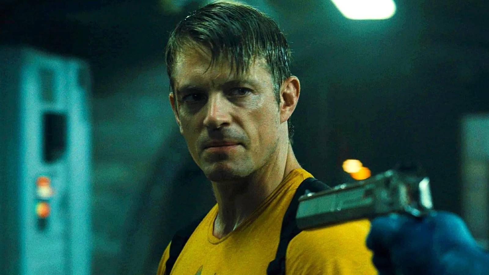 Rick Flag looking angry as Peacemaker points a gun at him in The Suicide Squad (2021)