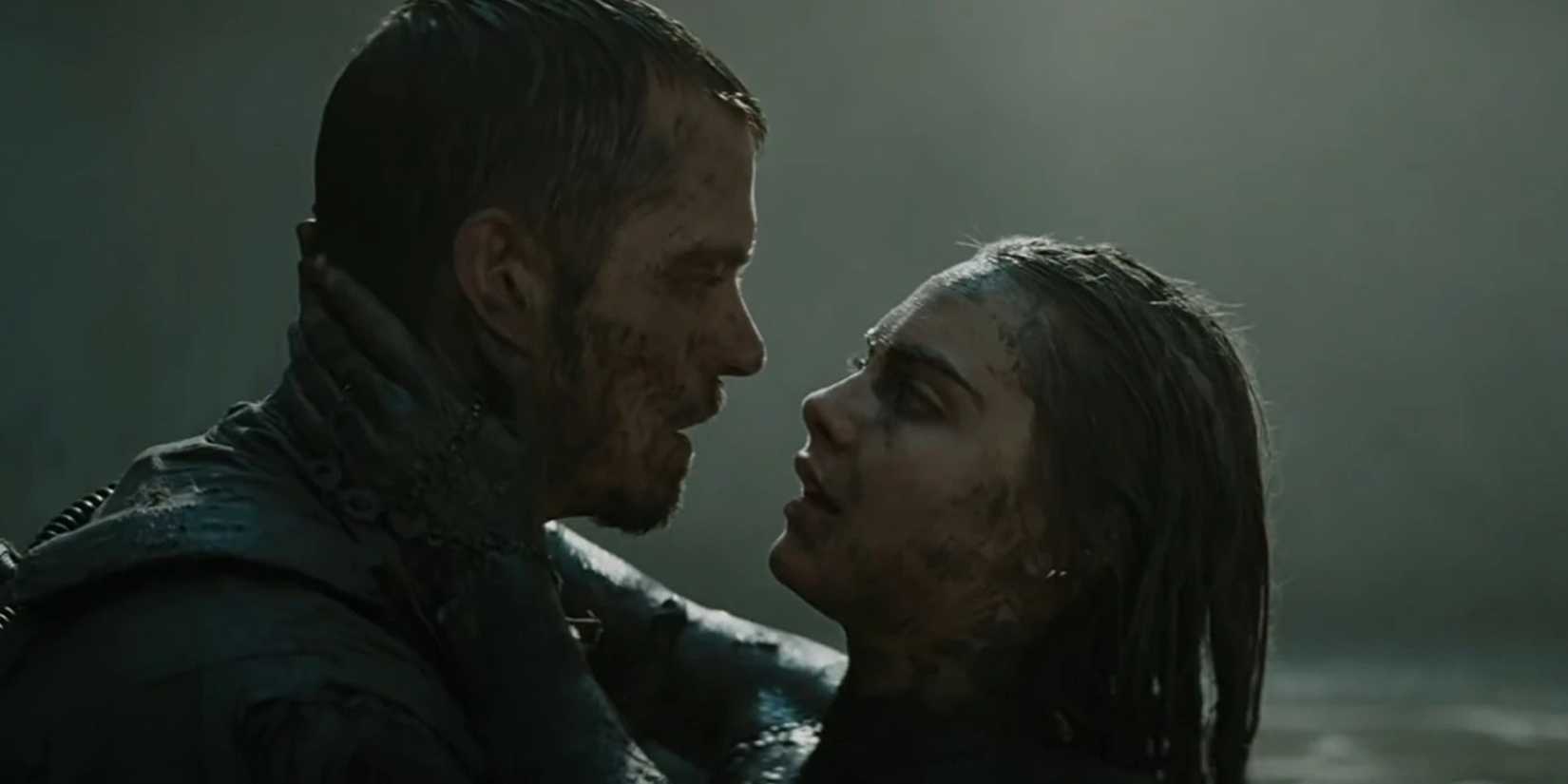 Rick Flag and June Moon looking at each other while covered in mud in Suicide Squad (2016)