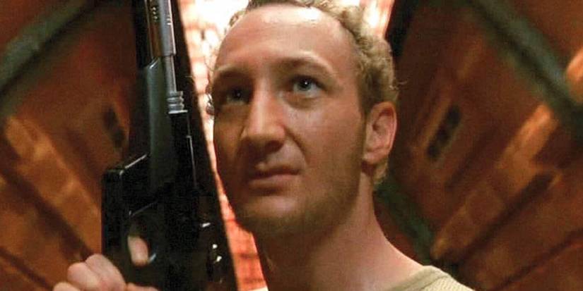 Robert Englund holding a gun in Galaxy of Terror