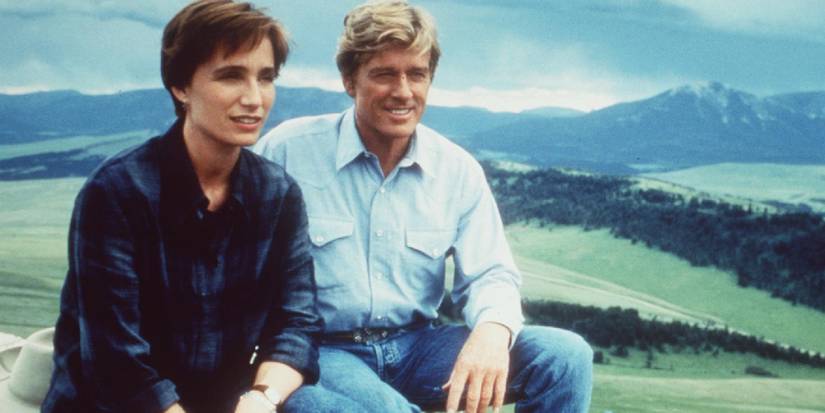 Robert Redford and Kristin Scott Thomas sitting together in The Horse Whisperer