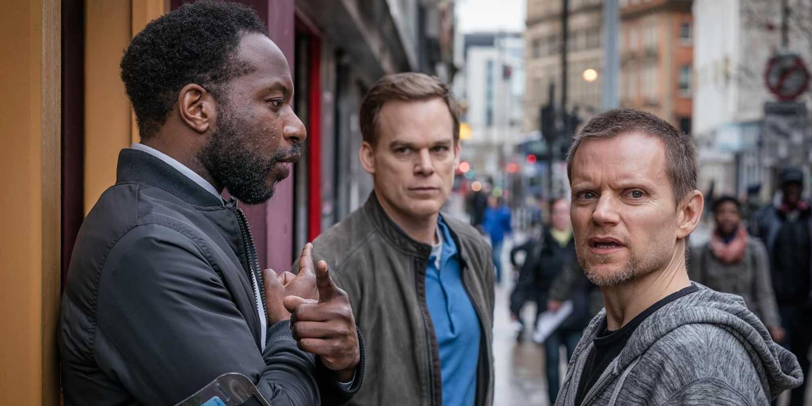 Michael C. Hall, Marc Warren and Gabriel Paul standing in the street safely