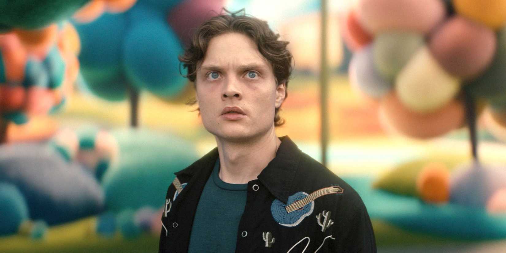 Sam (Asa Germann) looking surprised while standing in a colorful town in Gen V season 2 