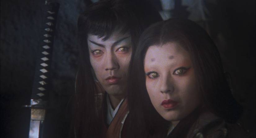 A man and woman look on with gold eyes in Samurai Reincarnation