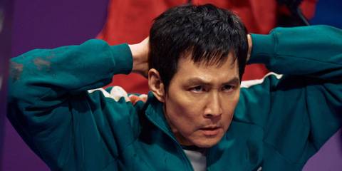 Seon Gi-hun with his hands behind his head in Squid Game