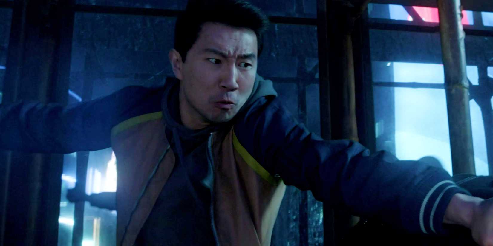 Shang-Chi fights the Ten Rings on scaffolding in Madripaur in Shang-Chi and the Legend of the Ten Rings
