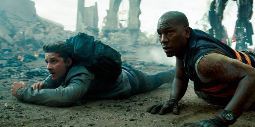 Shia LaBeouf and Tyrese Gibson on the ground in Transformers Dark of the Moon