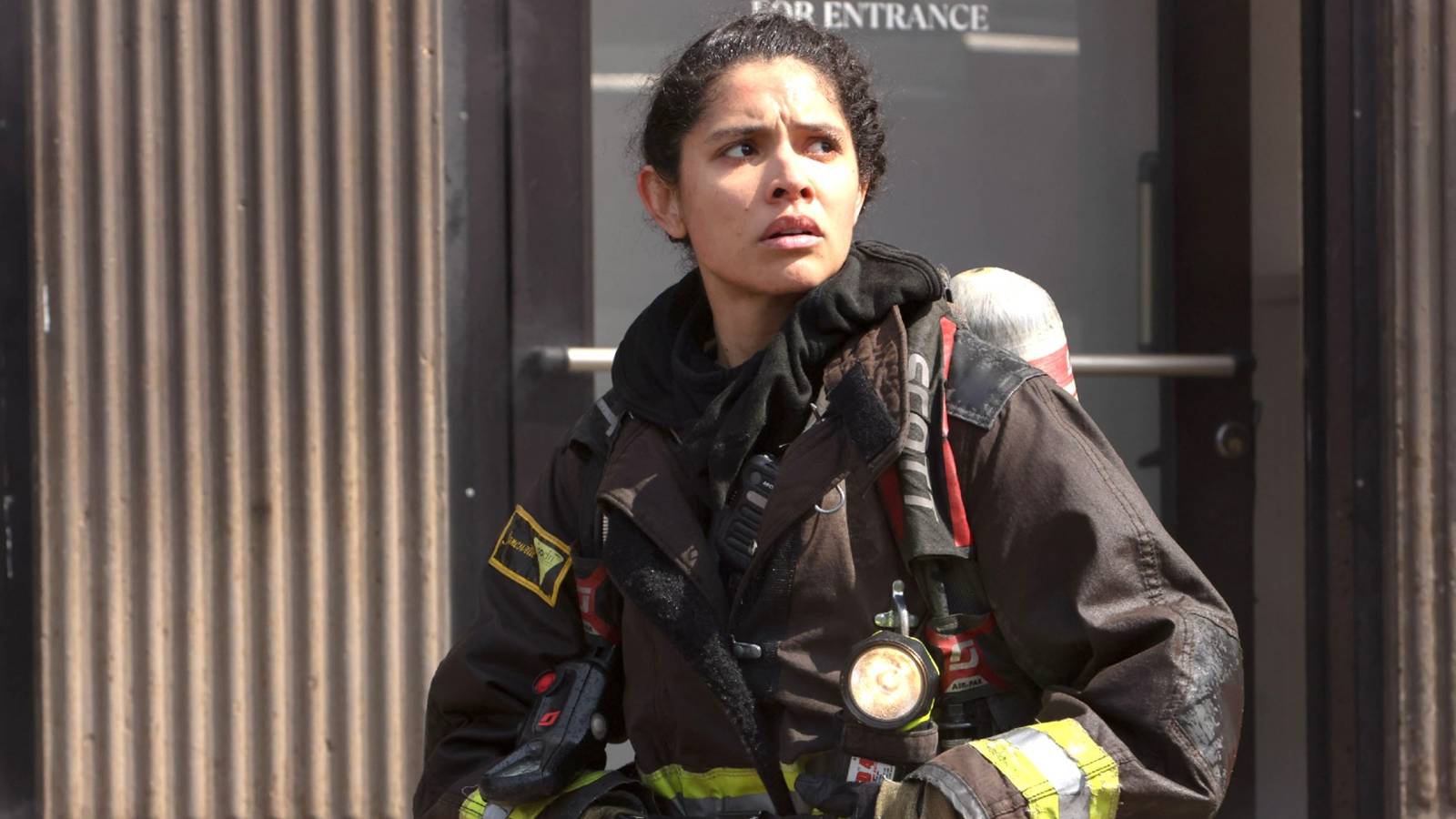 Stella in her firefighter uniform looking up and to the side in Chicago Fire season 11