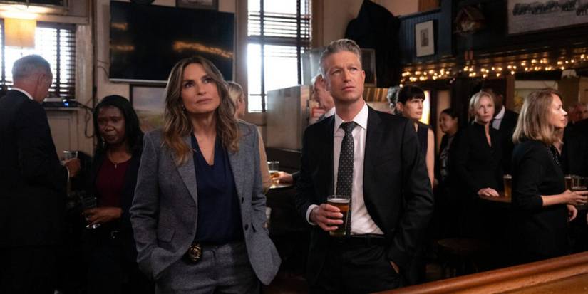 Olivia Benson (Mariska Hargitay) and Sonny Carisi (Peter Scanavino) at the memorial for Don Cragen (Dann Florek) in Law & Order: SVU season 27