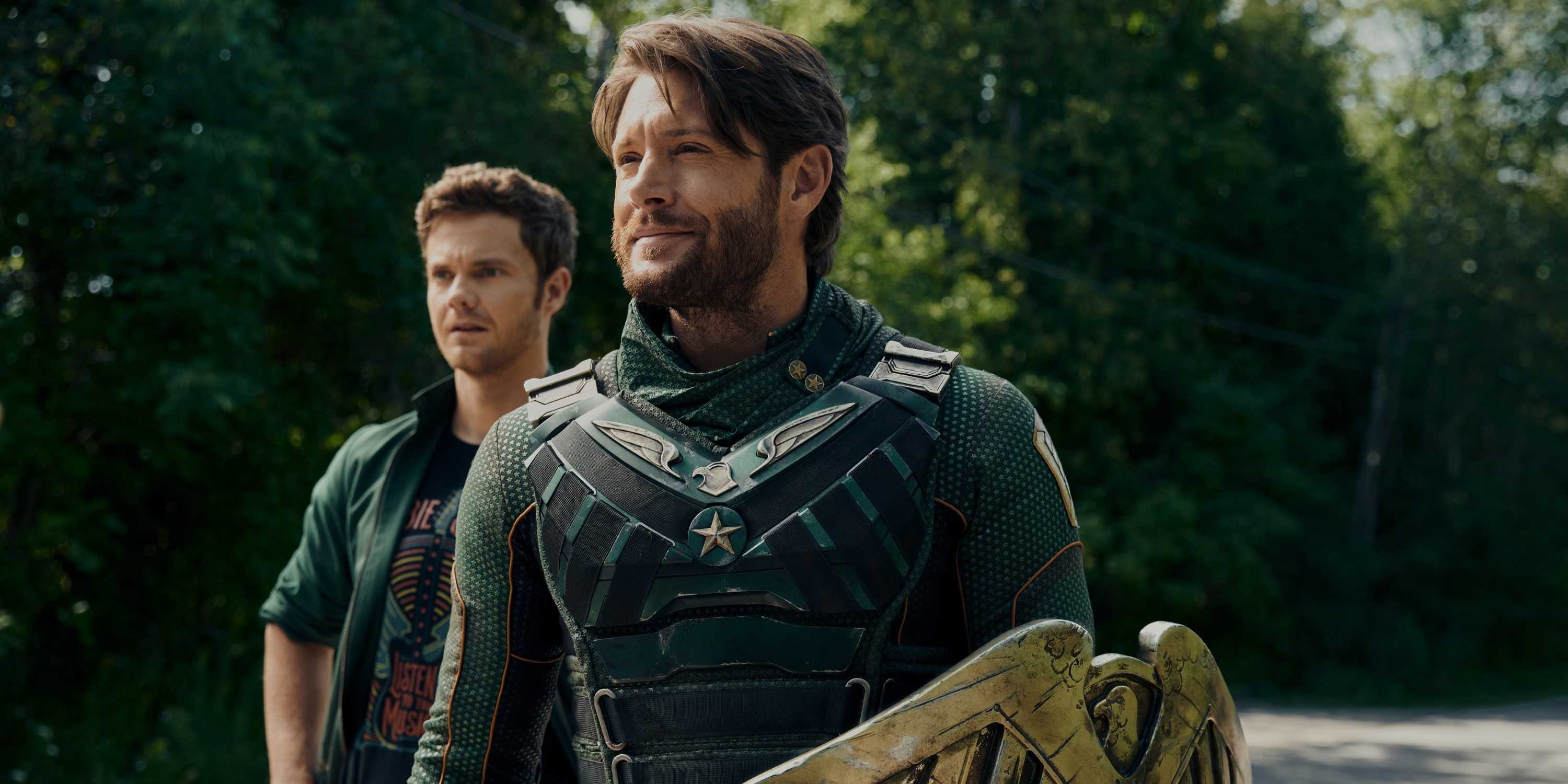 Soldier Boy (Jensen Ackles) smiling while Hughie (Jack Quaid) stands behind him in The Boys