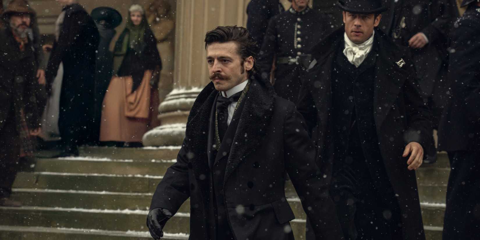 Anthony Boyle and James Norton walking down the stairs in House of Guinness