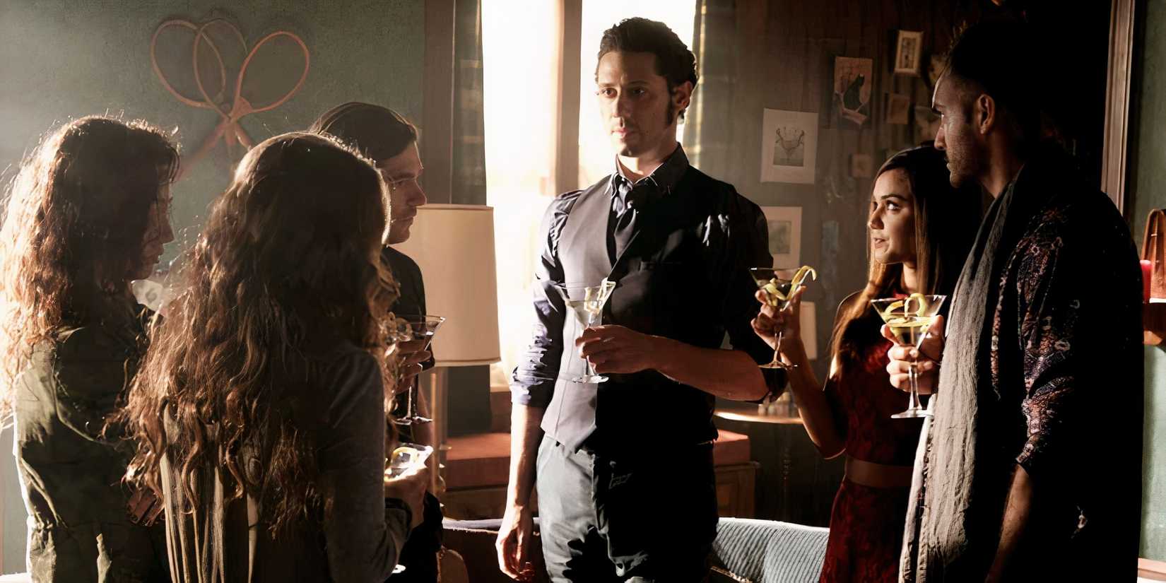 The central characters drinking a cocktail in The Magicians