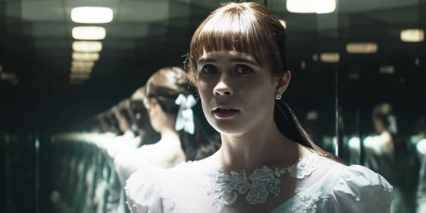 Judy Warren standing in front of a mirror in The Conjuring: Last Rites.
