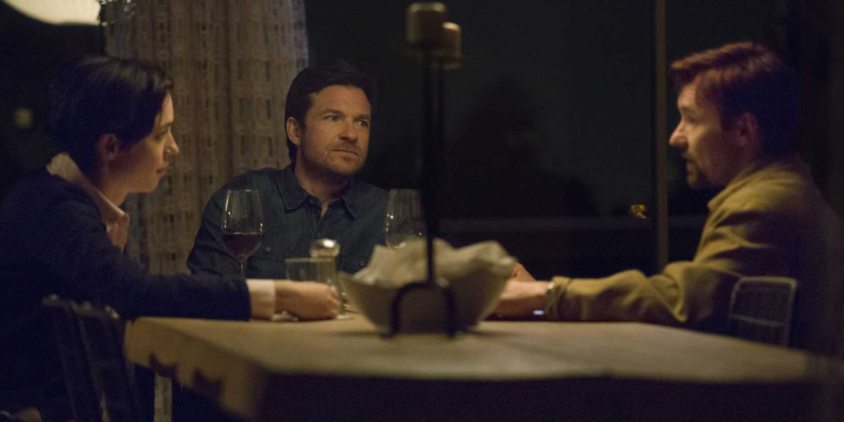 Robyn, Simon, and Gordo have a tense dinner in the 2015 horror movie The Gift.
