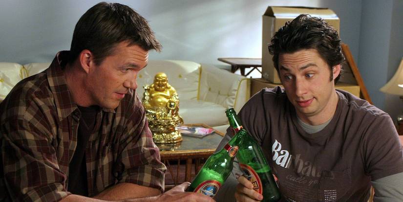 The Janitor and J.D. cheers their beer bottles on Scrubs