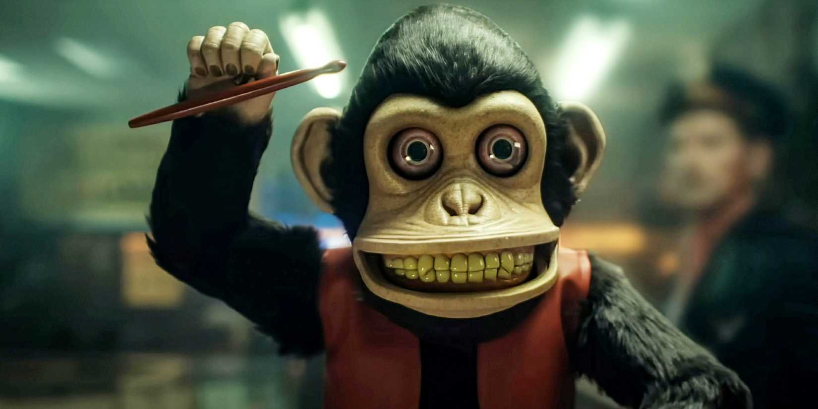 The Monkey holding a drumstick and looking menacing