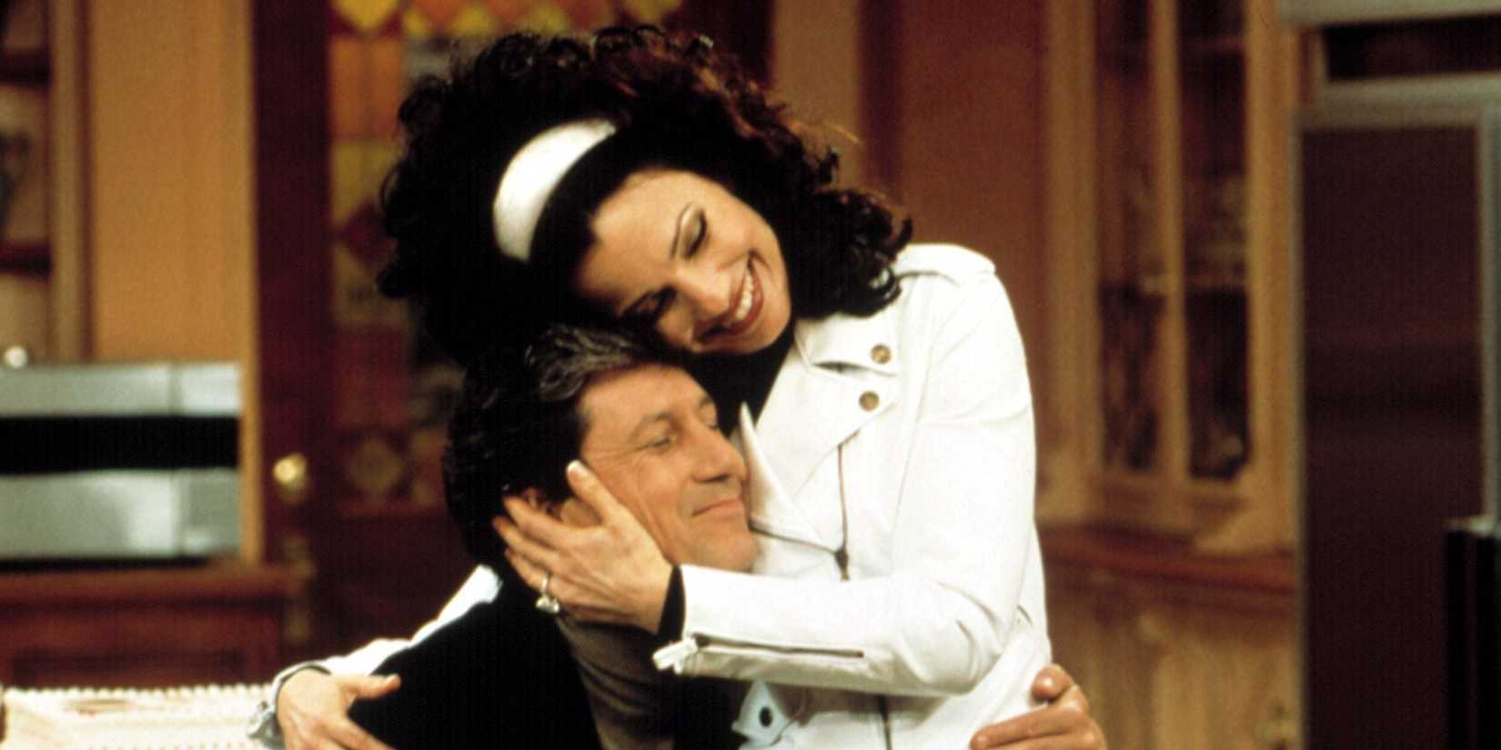 Fran Drescher and Charles Shaughnessy embracing in The Nanny
