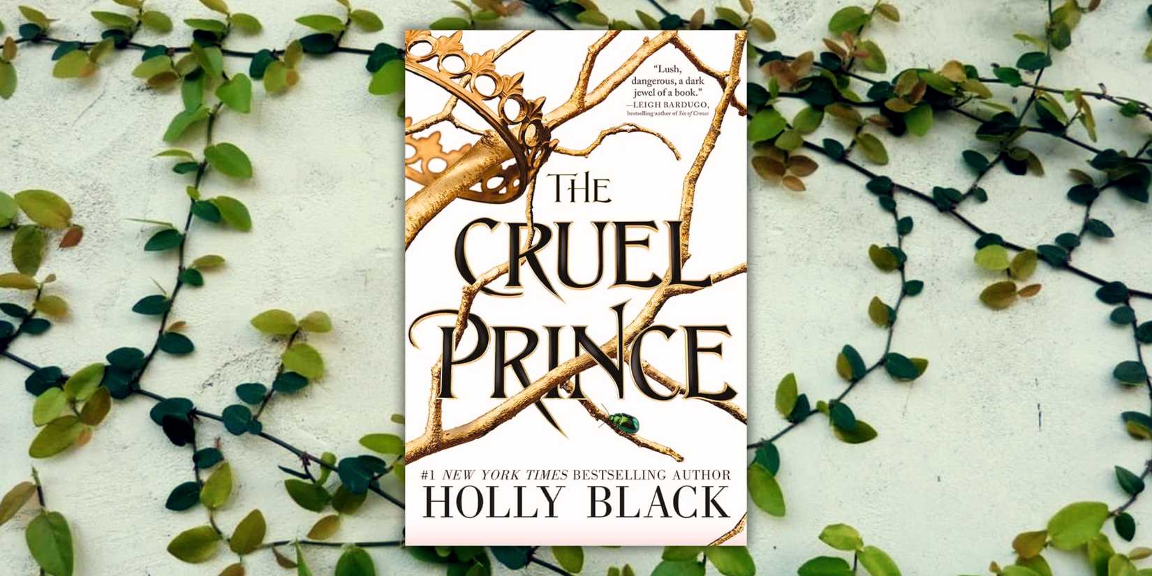 The cover of the book The Cruel Prince over a wall of vines