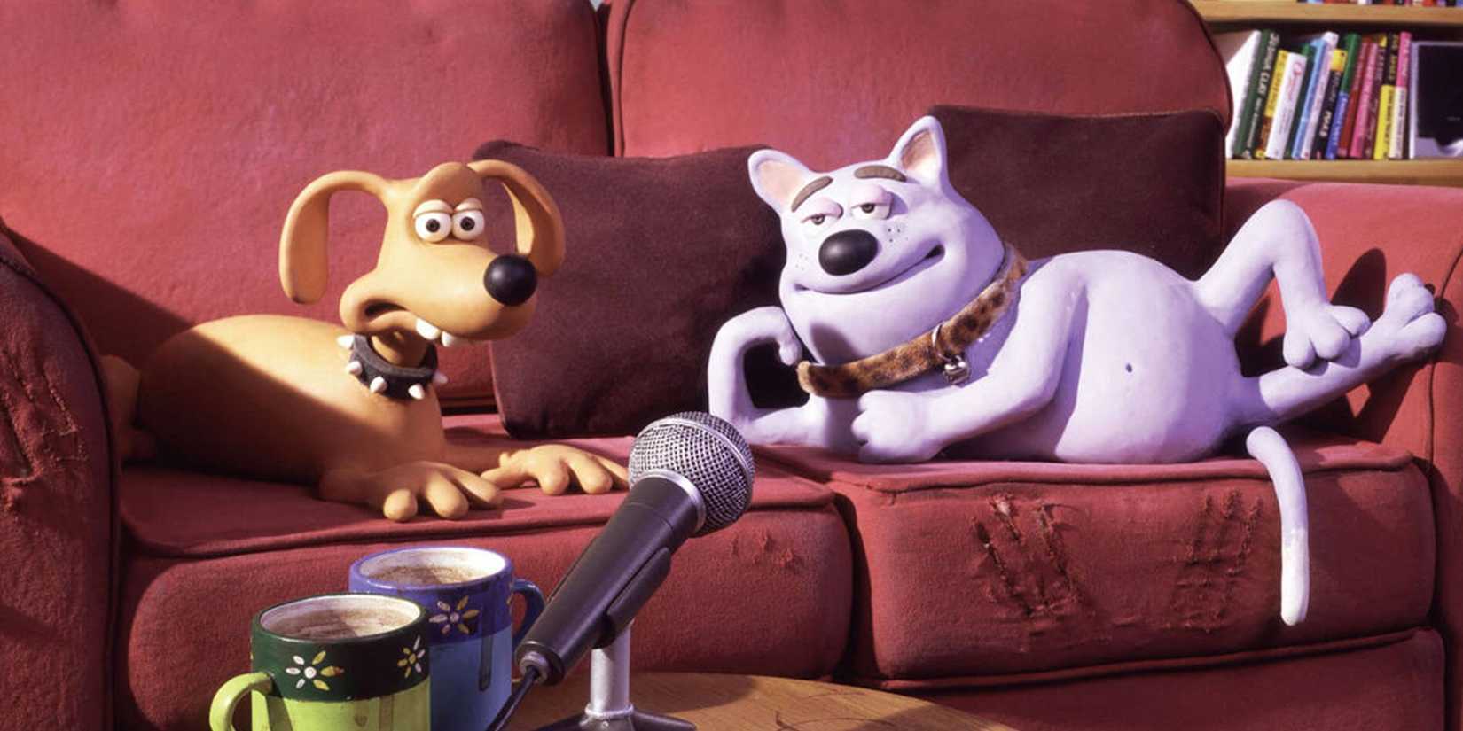 Two dogs on a couch in Creature Comforts