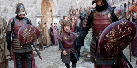 Tyrion looking concerned in a Crowd In Game Of Thrones Season 2 Episode 6