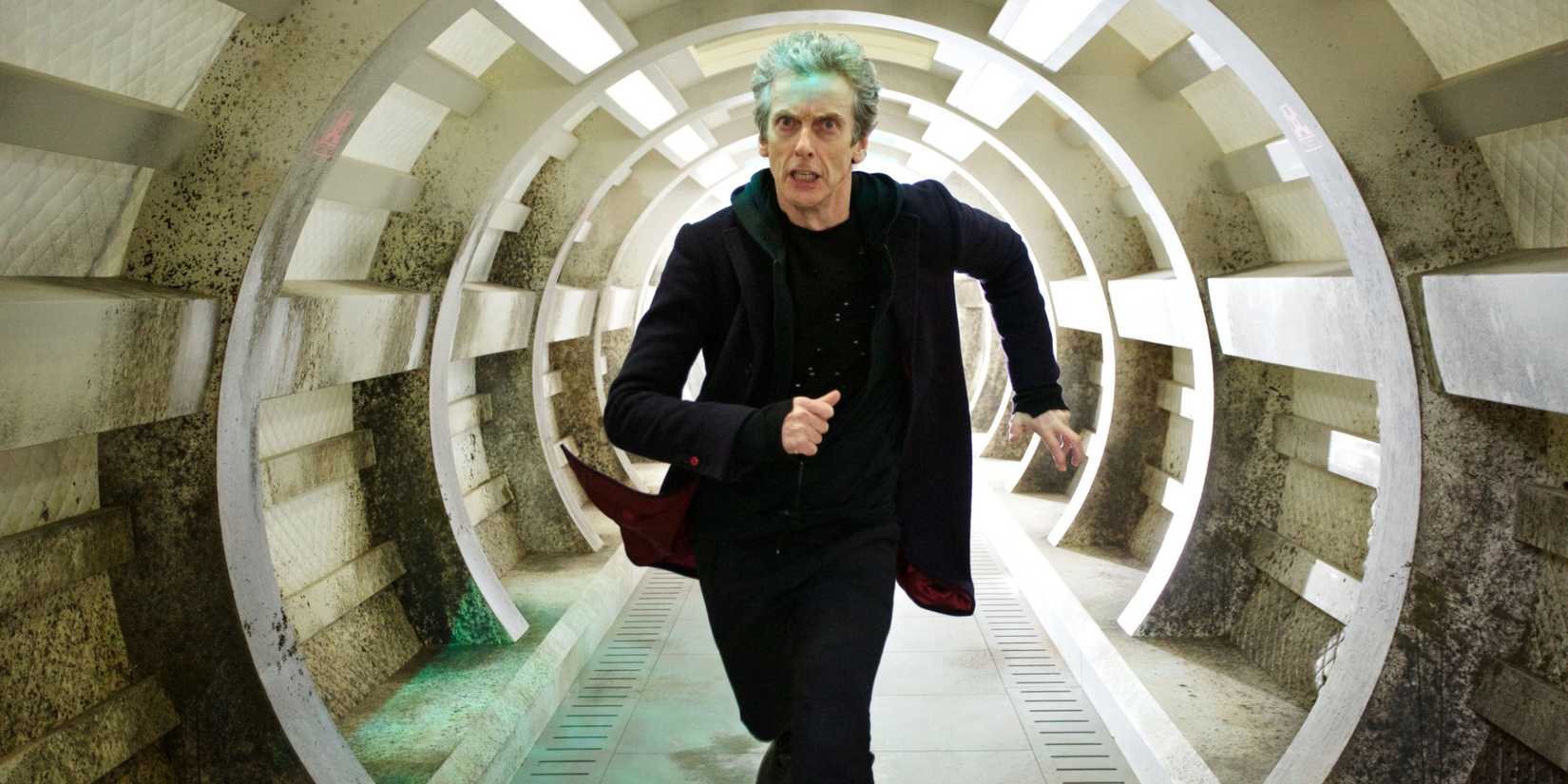 The Twelfth Doctor running down a corridor, looking scared, in the Doctor Who episode “Under the Lake.” 